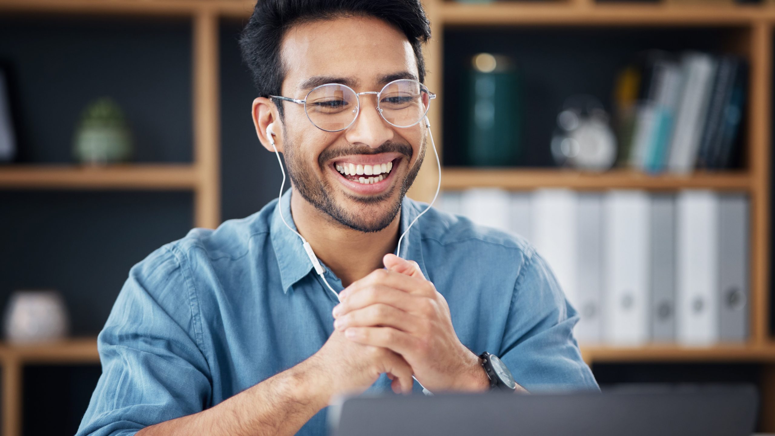 Happy employee engaging with computer